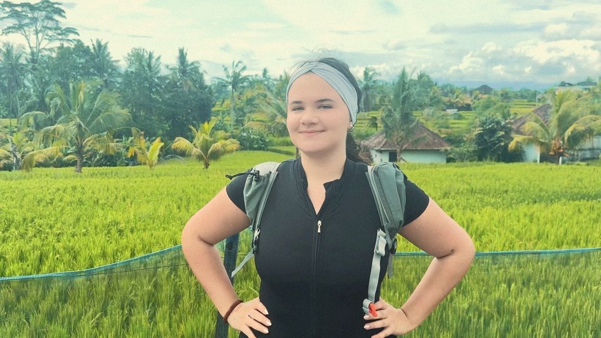 Hannah hiking through rice fields in Bali
