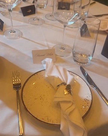 Hannah's place card at a brand dinner