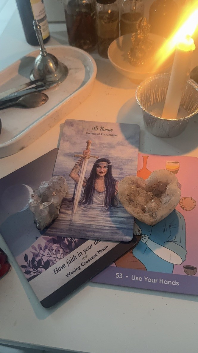 Oracle cards with crystals by candlelight